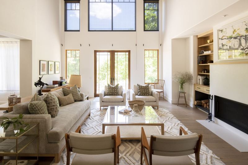 Living room: Double-height glazing, built-in shelving